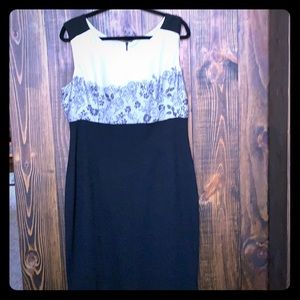 Dress, black with white top, lace print detail.